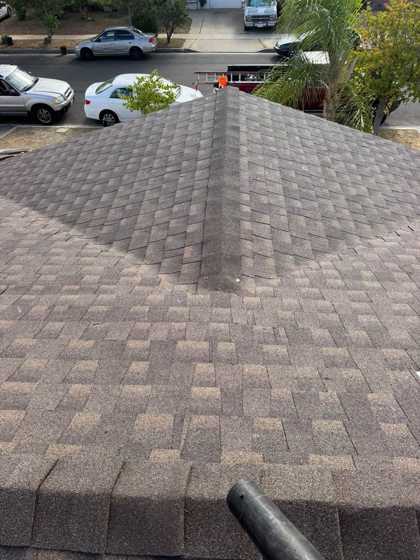 Hip roof with fresh shingles and ridge cap