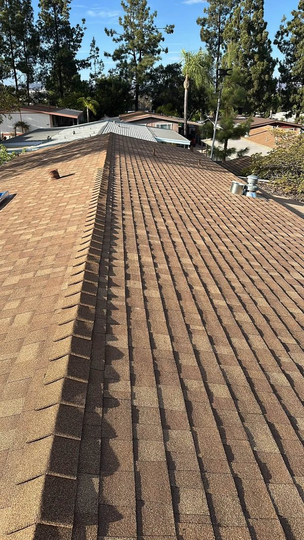 Long ridge line on a new shingle roof